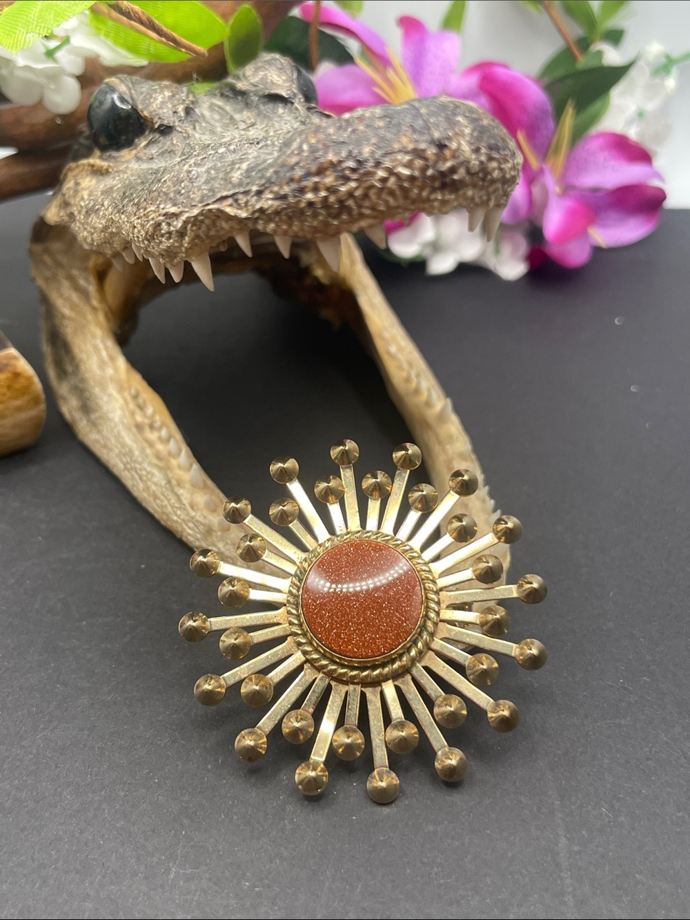 Starburst brooch with gold stone center vintage